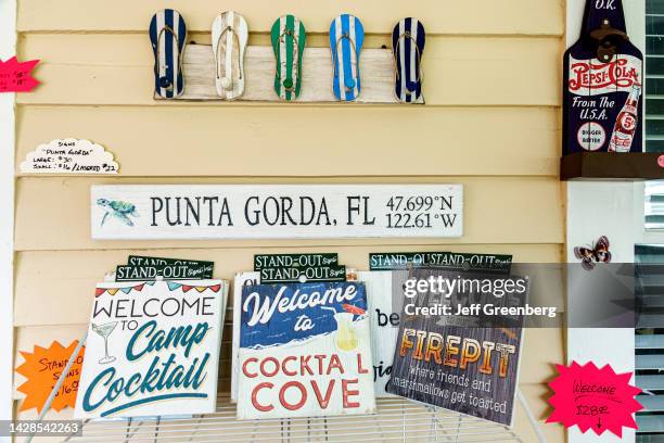 Punta Gorda, Florida, Historic District, Splash of Madness Coastal Beautique, wood sign display.