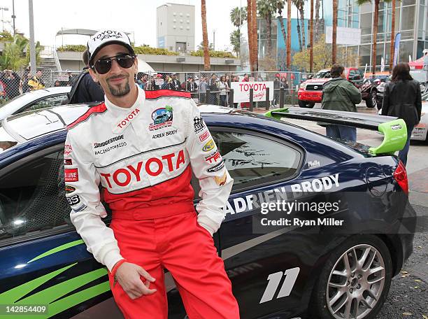 Actor Adrien Brody poses with his car during the 36th Annual Toyota Pro/Celebrity Race - Press Practice Day of the Toyota Grand Prix of Long Beach on...