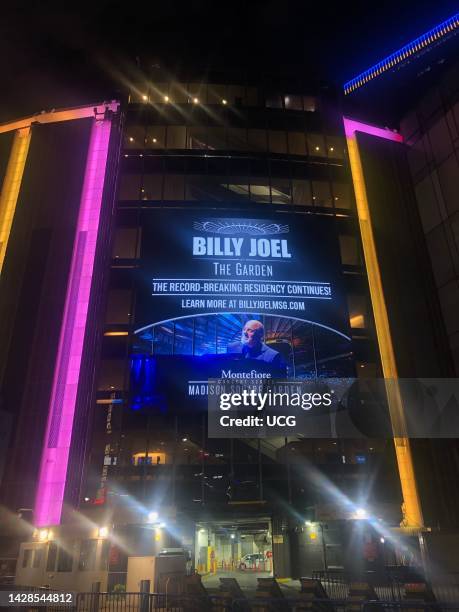 Madison Square Garden with billboard advertising Billy Joel's record breaking residency and concert series, Manhattan.
