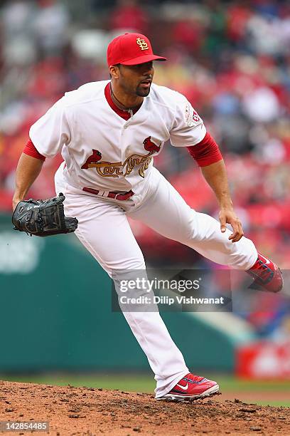 Reliever J.C. Romero of the St. Louis Cardinals pitches against the Chicago Cubs during the home-opening game at Busch Stadium on April 13, 2012 in...