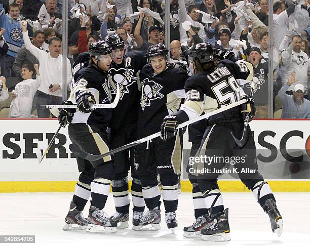 Chris Kunitz of the Pittsburgh Penguins celebrates his first period goal against the Philadelphia Flyers in Game Two of the Eastern Conference...