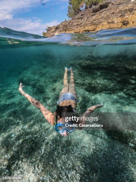 little girl snorkelling and discover the ocean flor - croatia girls stock pictures, royalty-free photos & images