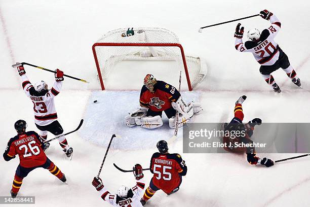 Ryan Carter of the New Jersey Devils celebrates his goal with teammate David Clarkson against Goaltender Jose Theodore of the Florida Panthers in...