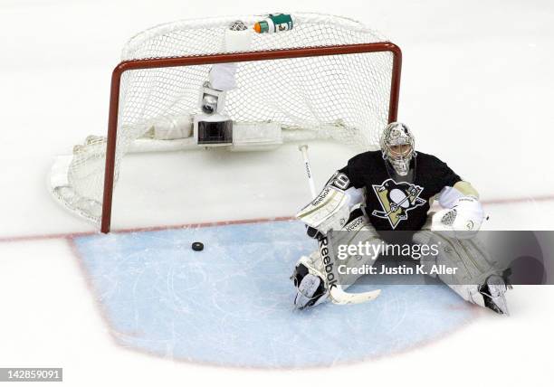 Marc-Andre Fleury of the Pittsburgh Penguins reacts after giving up a goal in the third period against the Philadelphia Flyers in Game Two of the...