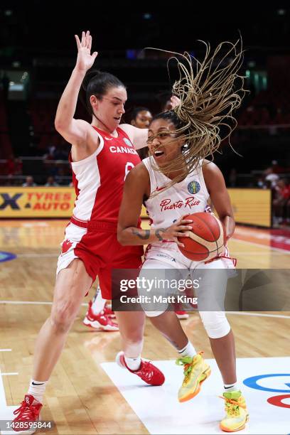 Arella Guirantes of Puerto Rico is challenged by Bridget Carleton of Canada during the 2022 FIBA Women's Basketball World Cup Group Canada match...