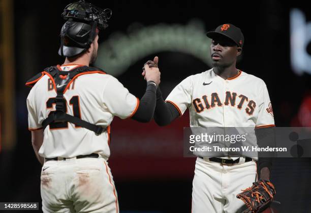 Joey Bart and Yunior Marte of the San Francisco Giants celebrates defeating the Colorado Rockies 6-3 at Oracle Park on September 28, 2022 in San...