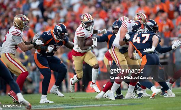 Jeff Wilson Jr. #22 of the San Francisco 49ers rushes during the game against the Denver Broncos at Empower Field At Mile High on September 25, 2022...