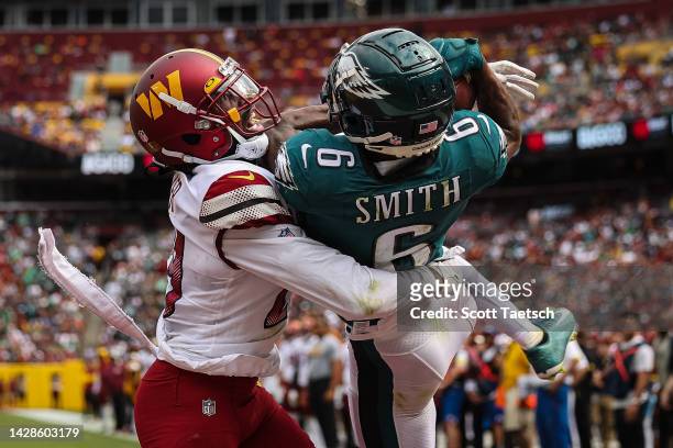 DeVonta Smith of the Philadelphia Eagles catches a pass for a touchdown against Kendall Fuller of the Washington Commanders during the first half at...