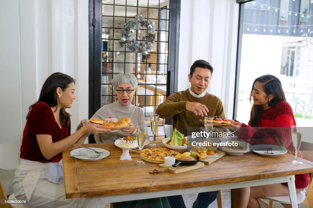 Group of family have dinner at Christmas time.