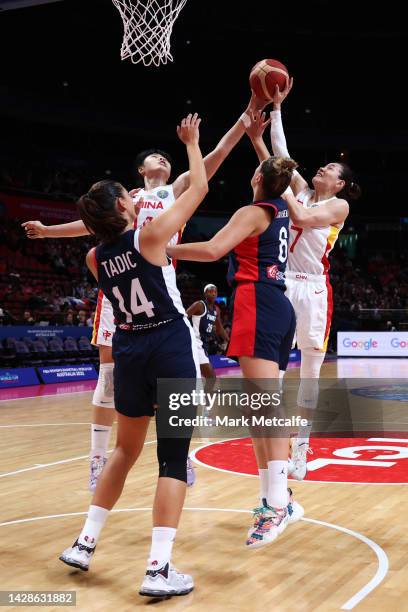 Liwei Yang of China and Yueru Li of China compete for a rebound with Ana Tadic of France and Alexia Chartereau of France during the 2022 FIBA Women's...