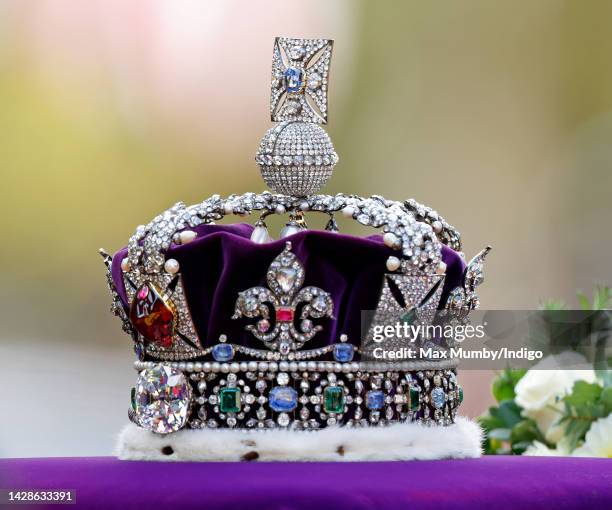 The Imperial State Crown sits on top of Queen Elizabeth II's coffin as it is transported on a gun carriage from Buckingham Palace to The Palace of...