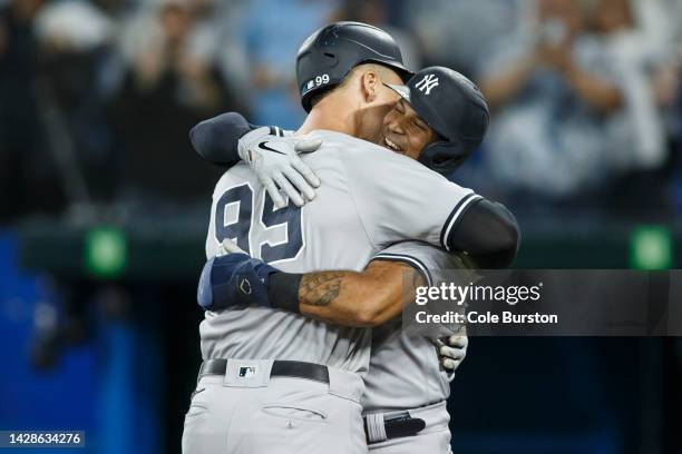 Aaron Judge of the New York and Aaron Hicks of the New York Yankees celebrate Judge hitting his 61st home run of the season in the seventh inning...