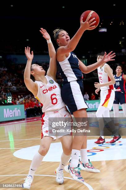 Alexia Chartereau of France competes for the ball against Tongtong Wu of China during the 2022 FIBA Women's Basketball World Cup Quarterfinal match...