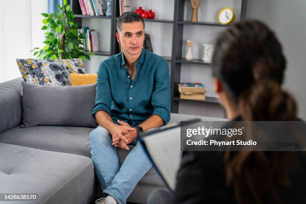 having psychotherapy session at psychologist's office - psychiatrists couch stock pictures, royalty-free photos & images