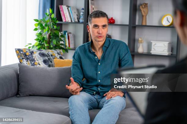 having psychotherapy session at psychologist's office - bipolar disorder stock pictures, royalty-free photos & images