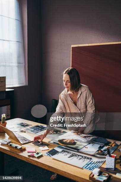 a serious beautiful businesswoman working on her photography pro - computer portfolio stock pictures, royalty-free photos & images