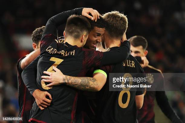 Felix Nmecha of Germany celebrates with team mates after scoring his sides first goal during the International Friendly Match between England U21 and...