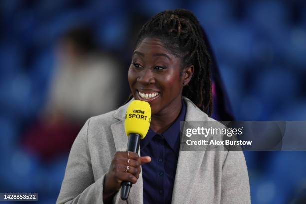 Anita Asante, former professional footballer talks ptichside prior to the FA Women's Super League match between Chelsea and West Ham United at...