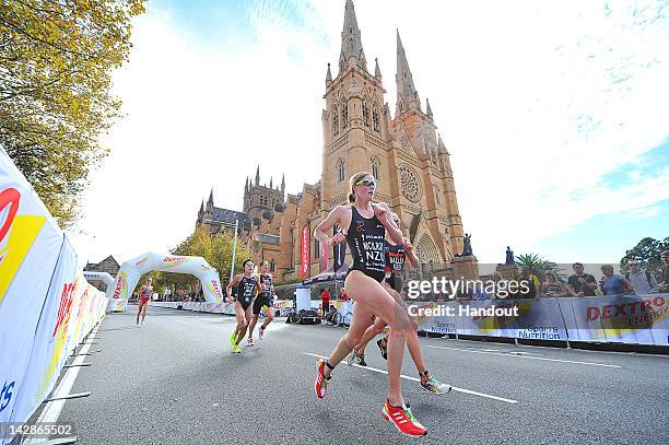 In this handout photo provided by the International Triathlon Union, New Zealand's Kate McIlroy and Germany's Svenja Bazlen run past St. Mary's...