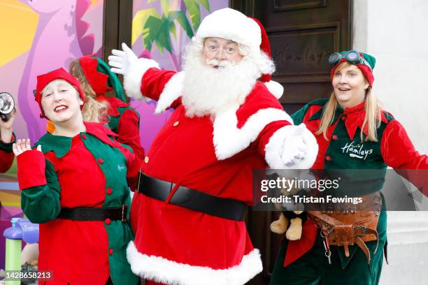Santa and elves pose for a photo as Hamleys unveil their Top Ten Toys for Christmas, on September 29, 2022 in London, England.