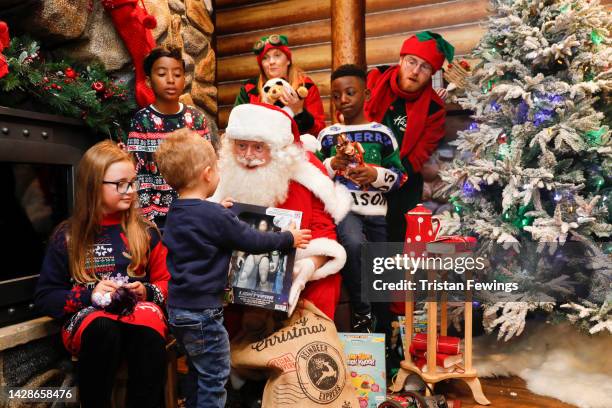 Santa with children in the grotto as Hamleys unveil their Top Ten Toys for Christmas, on September 29, 2022 in London, England.