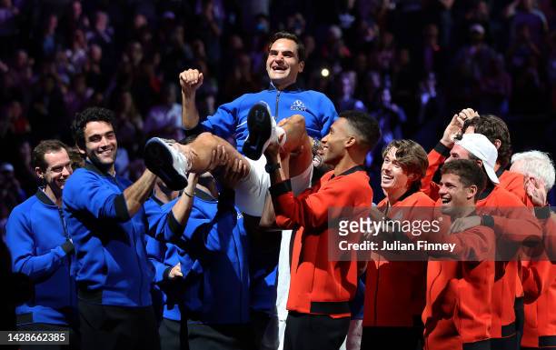 Roger Federer of Team Europe is lifted up after his last match in the doubles between Jack Sock and Frances Tiafoe of Team World and Roger Federer...