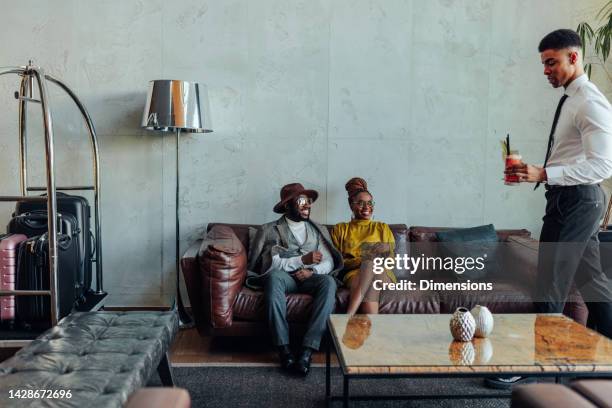 african american couple in luxurious hotel. - star style lounge imagens e fotografias de stock