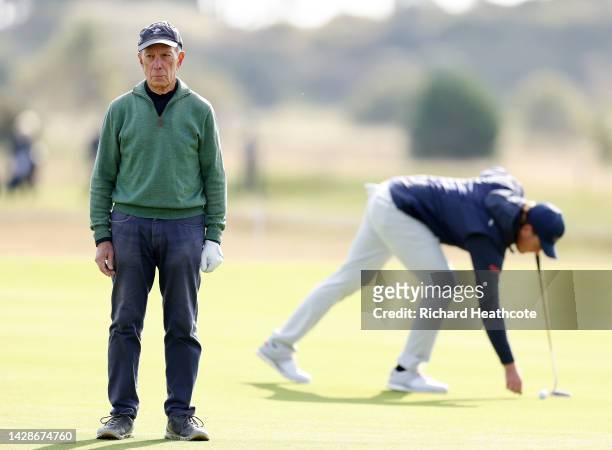 Mike Bloomberg, Former Mayor of New York City, looks on as Eddie Pepperell of England prepares to putt on the 15th hole on Day One of the Alfred...