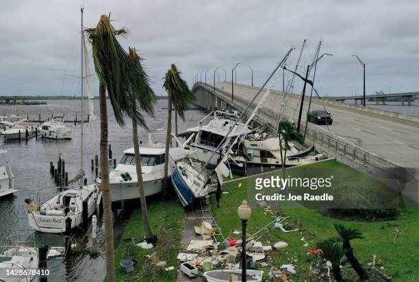Boats are pushed up on a causeway after Hurricane Ian passed through the area on September 29, 2022 in Fort Myers, Florida. The hurricane brought...