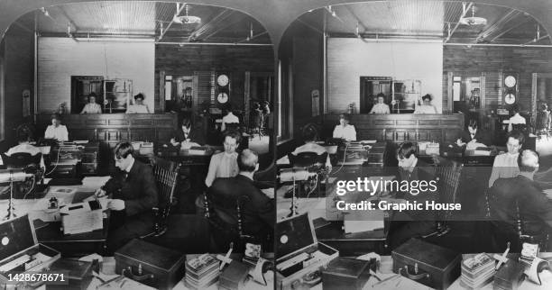 Stereoscopic image showing people working at their desks in the offices of Perfecscopes and Perfec-Stereographs, with the viewers in their cases in...