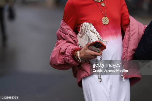 Fashion week guest seen wearing a tie dye red and white dress, outside Mame Kurogouchi during Paris Fashion Week on September 27, 2022 in Paris,...