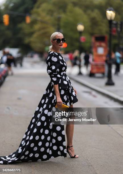 Liv Judd seen wearing a vokuhila polka dot dress, outside Carolina Herrera during new york fashion week on September 12, 2022 in New York City.