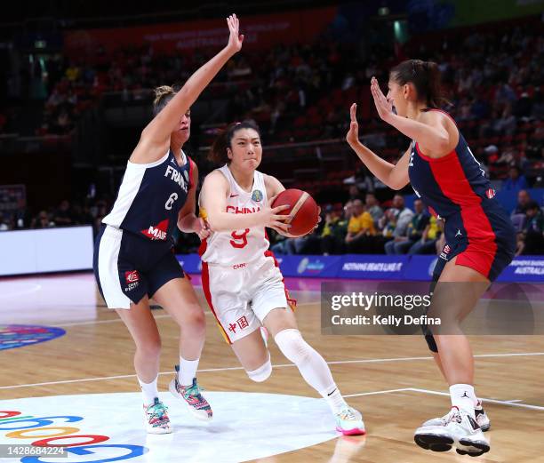 Meng Li of China drives past Alexia Chartereau of France during the 2022 FIBA Women's Basketball World Cup Quarterfinal match between China and...