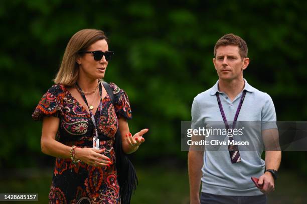 Natalie Pinkham and Anthony Davidson walk in the Paddock during previews ahead of the F1 Grand Prix of Singapore at Marina Bay Street Circuit on...