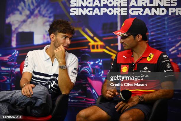 Pierre Gasly of France and Scuderia AlphaTauri and Carlos Sainz of Spain and Ferrari talk in the Drivers Press Conference during previews ahead of...