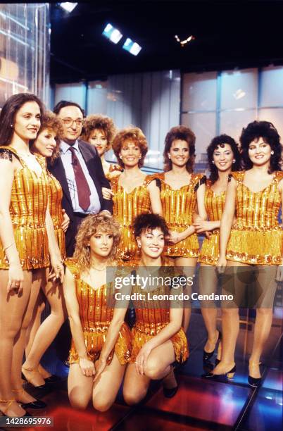 Italian politician Gianni De Michelis with showgirls of Italian television show 'Il bello della diretta', Milan, Italy, 1986.