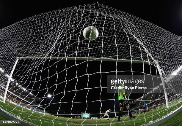 Jacob Burns of the Glory scores the winning penalty during the A-League Grand Final Qualifier match at Bluetongue Stadium on April 14, 2012 in...