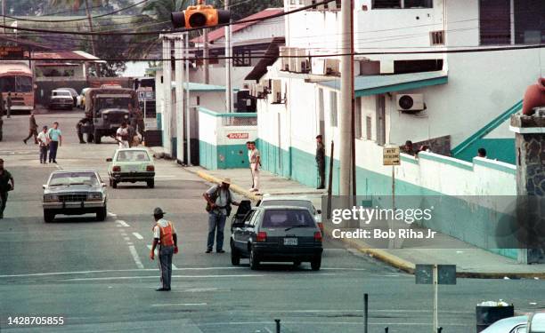 Panamanian Defense Troops and security personnel for General Manuel Noriega at security checkpoint at Headquarters compound, October 5, 1989 in...