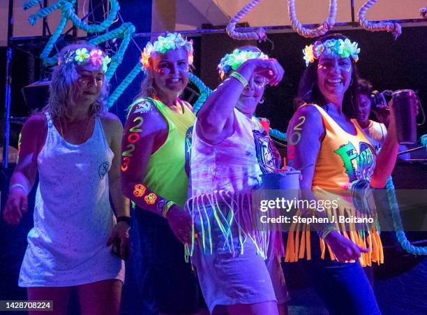 Women dance during the Full Moon Party on Hat Rin beach on Koh Phangan Island in the Gulf of Thailand.