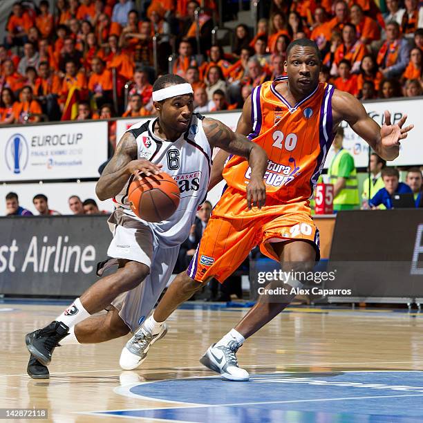 Tyrese Rice, #6 of Lietuvos Rytas competes with Florent Pietrus, #20 of Valencia Basket during the semifinal A of 2012 Eurocup Finals between...