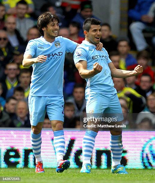 Sergio Aguero of Manchester City celebrates scoring his team's second goal with team mate David Silva during the Barclays Premier League match...