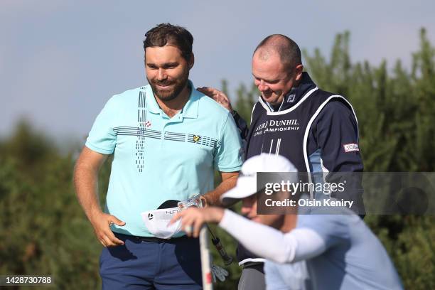 Romain Langasque of France interacts with their Caddie after putting on the 9th green on Day One of the Alfred Dunhill Links Championship on the Old...