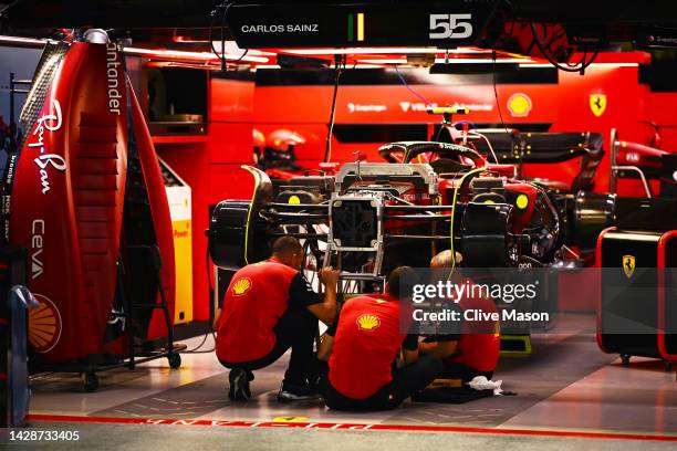The Ferrari team work in the garage during previews ahead of the F1 Grand Prix of Singapore at Marina Bay Street Circuit on September 29, 2022 in...