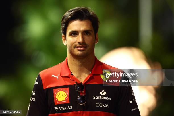 Carlos Sainz of Spain and Ferrari walks in the Paddock during previews ahead of the F1 Grand Prix of Singapore at Marina Bay Street Circuit on...