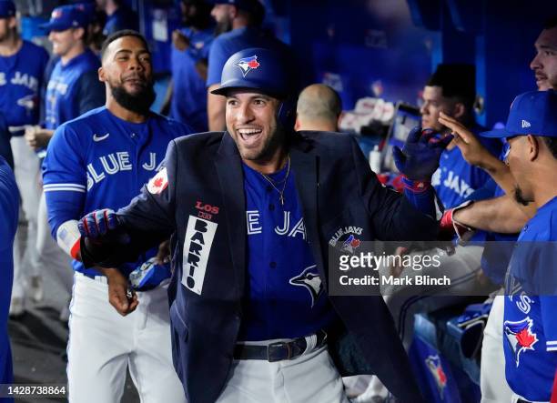 George Springer of the Toronto Blue Jays celebrates his home run with the blue jacket against the New York Yankees in the first inning during their...