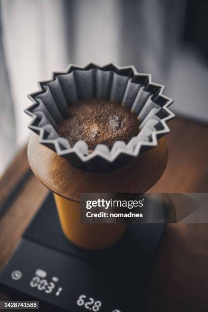 pour-over coffee with take away cup. drip coffee on camping table. - filterkaffee stock-fotos und bilder