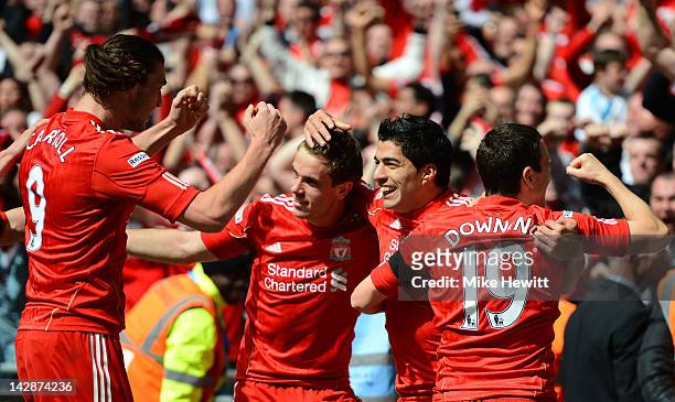 Luis Suarez of Liverpool celebrates with, Andy Carroll , Jordan Henderson and Stewart Downing as he scores their first goal during the FA Cup with...