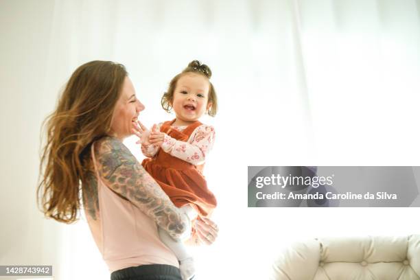 brazilian woman breastfeeding her baby - amanda mother stock pictures, royalty-free photos & images