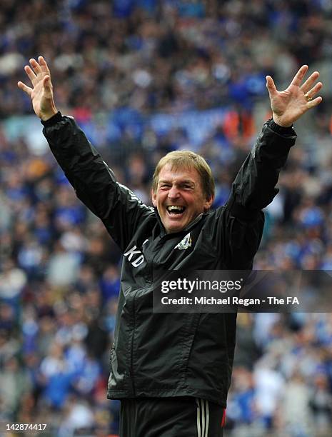 Liverpool manager Kenny Dalglish celebrates his sides second goal by Andy Carroll during the FA Cup with Budweiser Semi Final match between Liverpool...