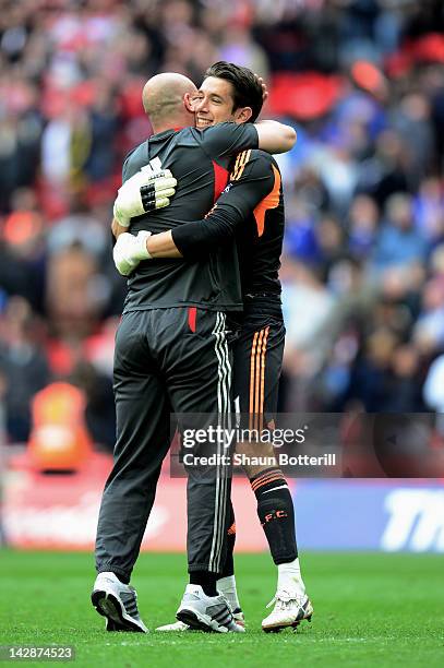 Brad Jones of Liverpool celebrates with fellow goalkeeper Pepe Reina after the FA Cup with Budweiser Semi Final match between Liverpool and Everton...